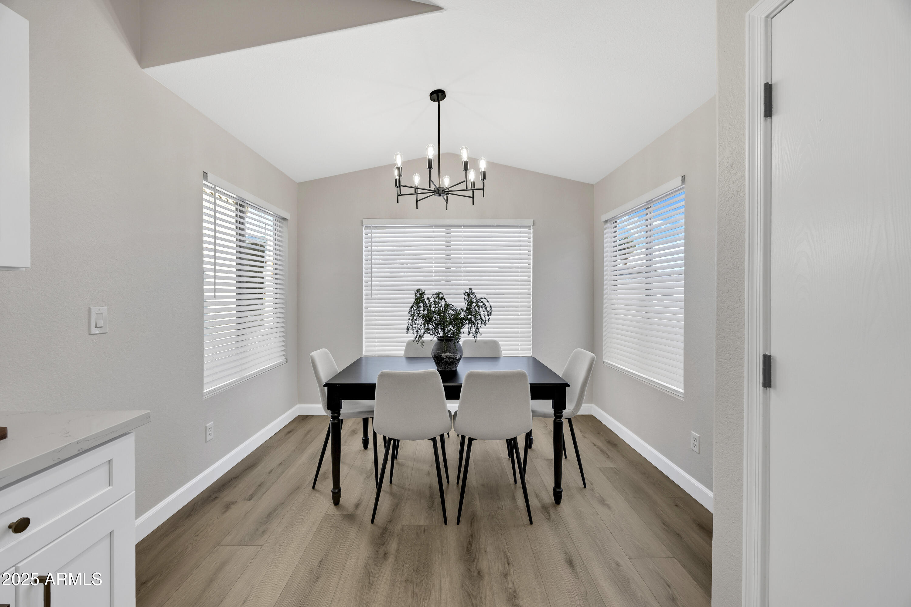 1228 West Diamond Avenue Apache Junction, AZ 85120 - Photo 11 of 25 a view of a dining room with furniture window and wooden floor