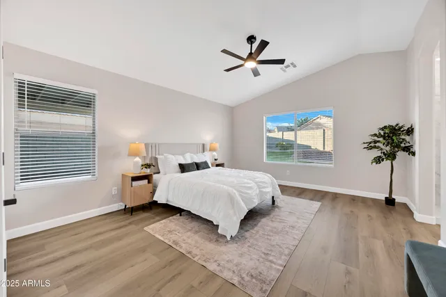 a bed room with a bed and a window