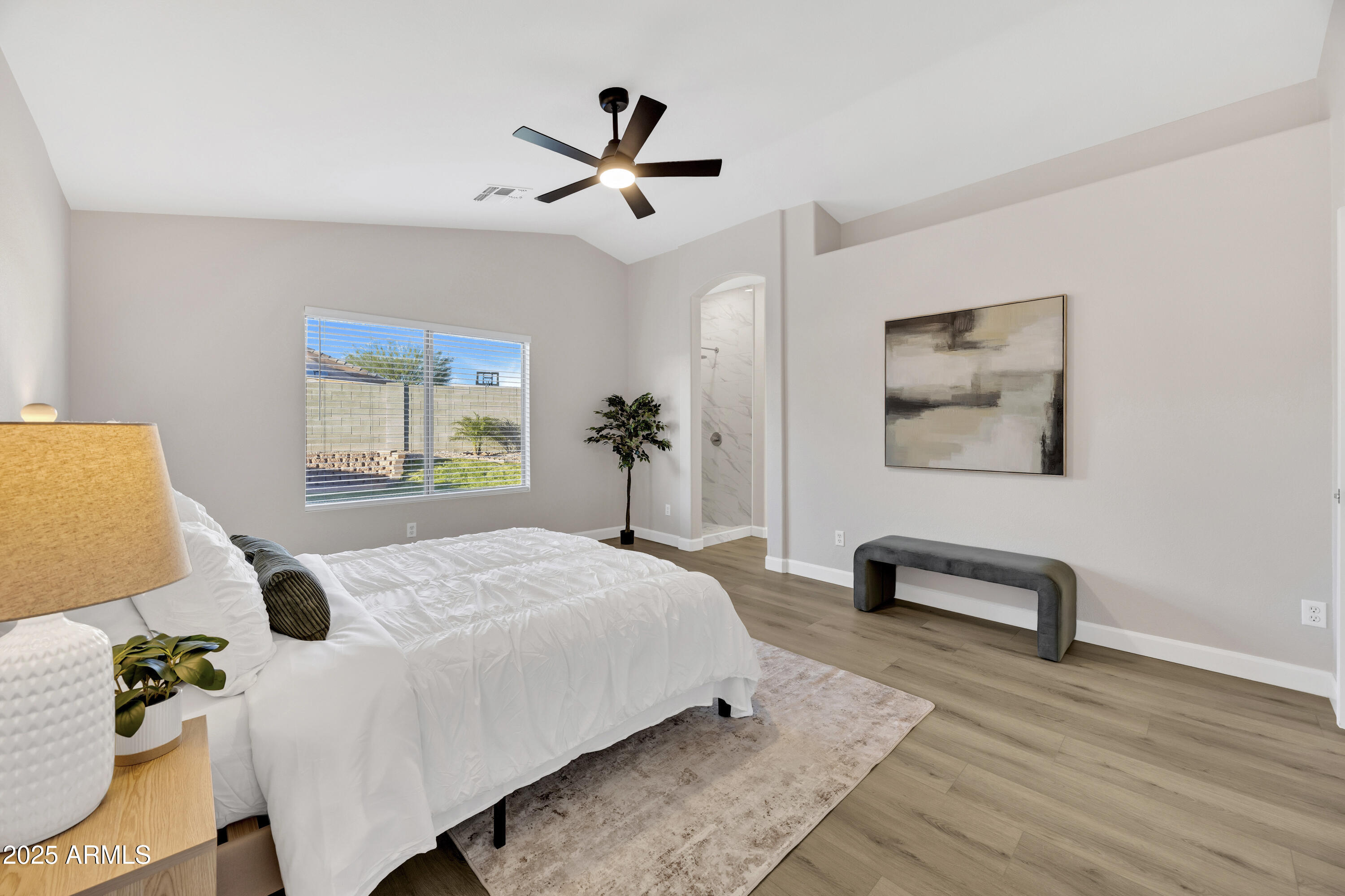 1228 West Diamond Avenue Apache Junction, AZ 85120 - Photo 13 of 25 a bedroom with a bed a couch and a window