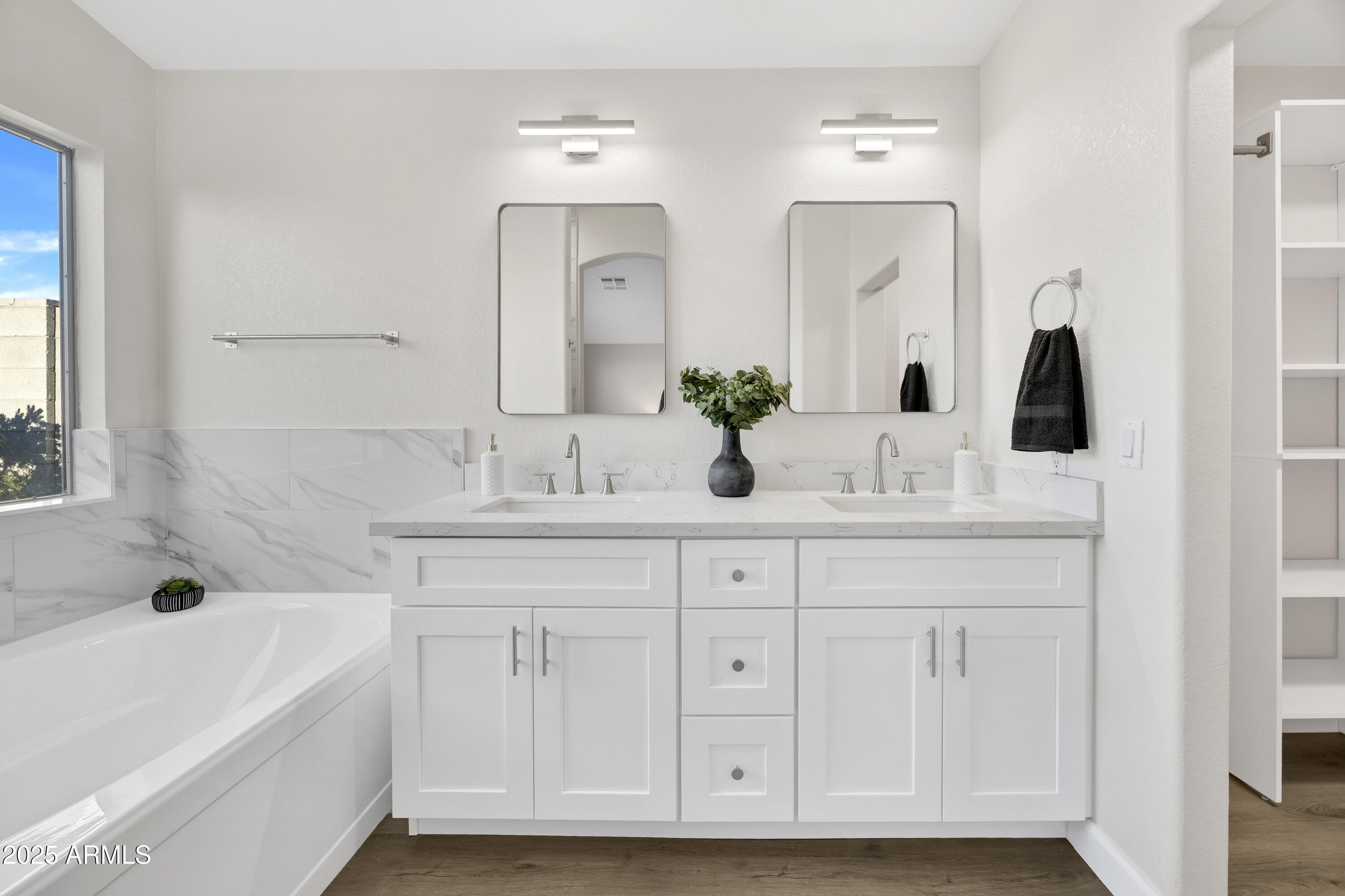 1228 West Diamond Avenue Apache Junction, AZ 85120 - Photo 14 of 25 a bathroom with a double vanity sink mirror and bathtub