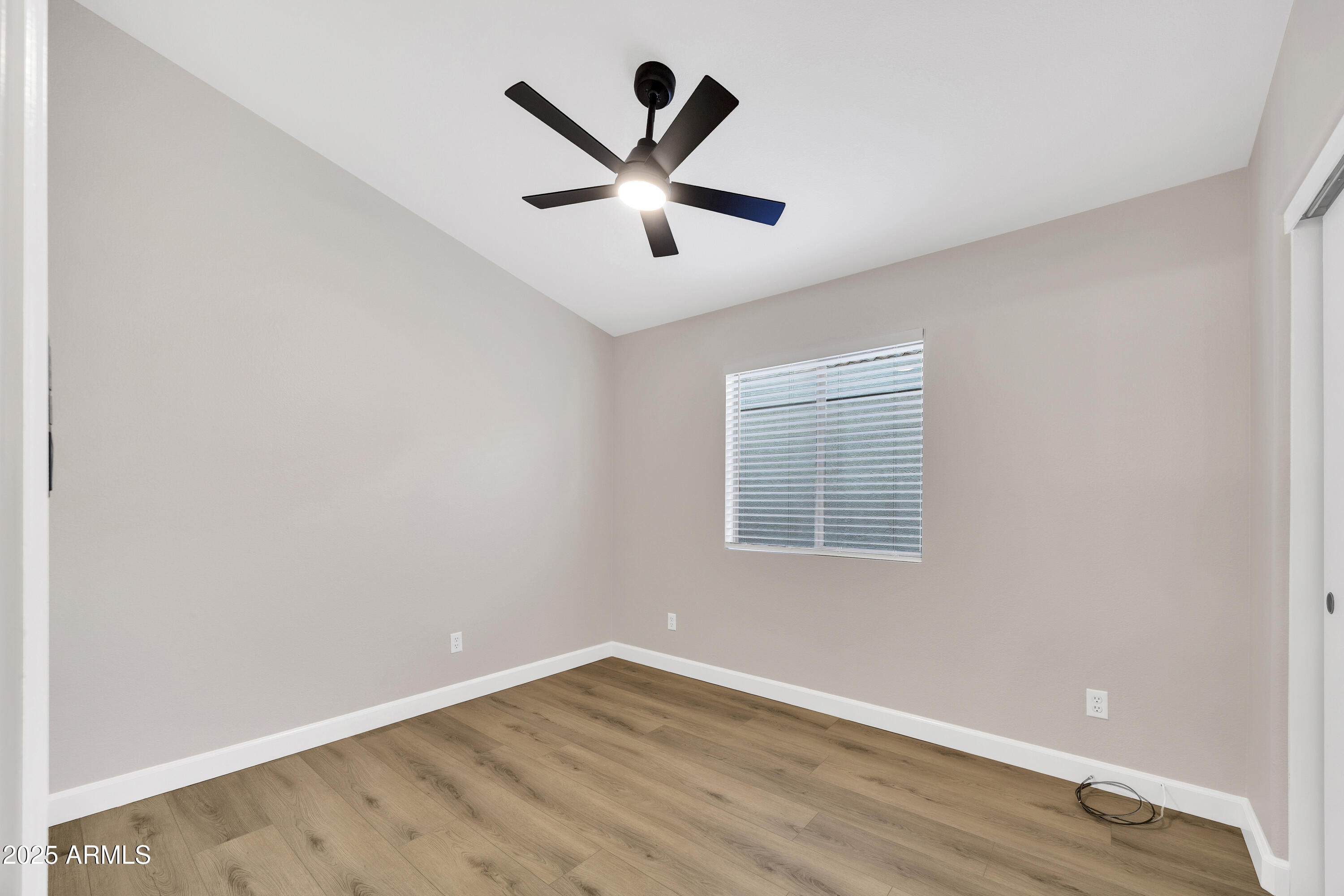 1228 West Diamond Avenue Apache Junction, AZ 85120 - Photo 17 of 25 an empty room with ceiling fan and window