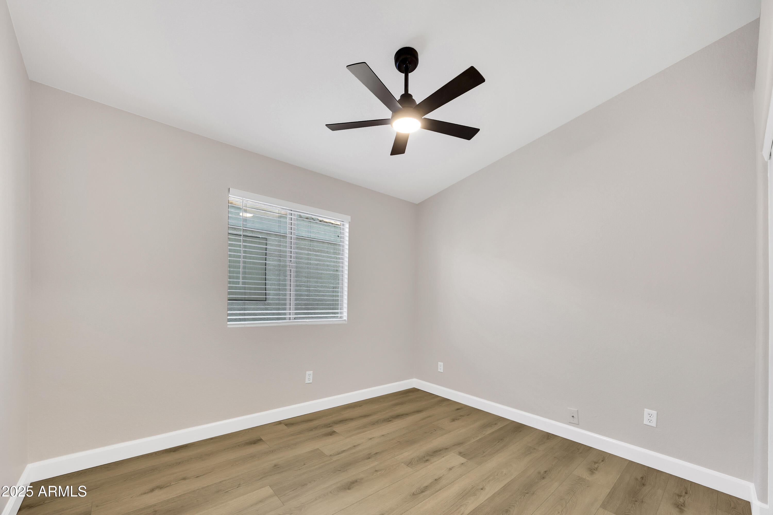 1228 West Diamond Avenue Apache Junction, AZ 85120 - Photo 19 of 25 a view of a big room with wooden floor and windows