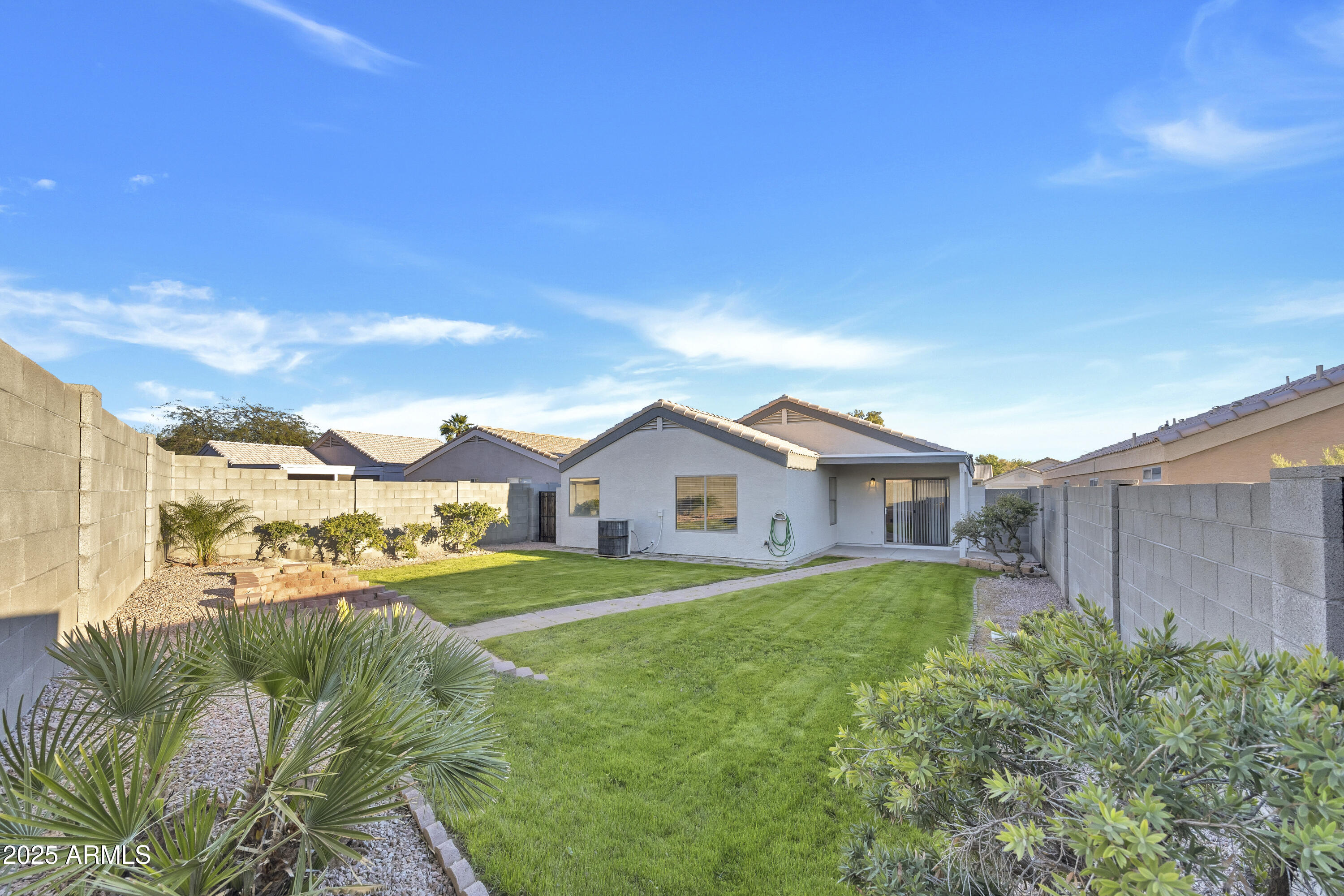 1228 West Diamond Avenue Apache Junction, AZ 85120 - Photo 23 of 25 a view of a big house with a big yard and large trees