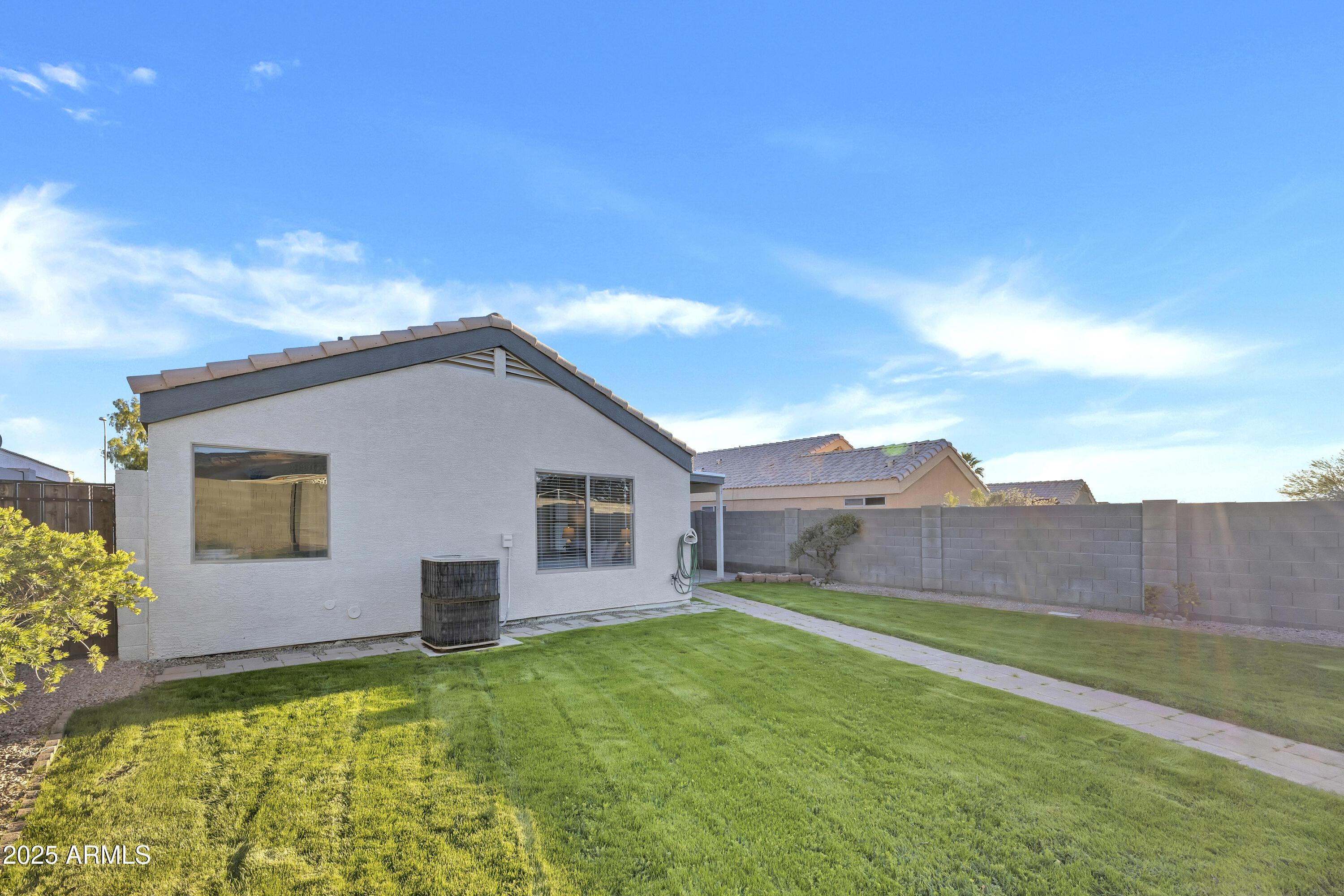 1228 West Diamond Avenue Apache Junction, AZ 85120 - Photo 24 of 25 a backyard of a house with table and chairs