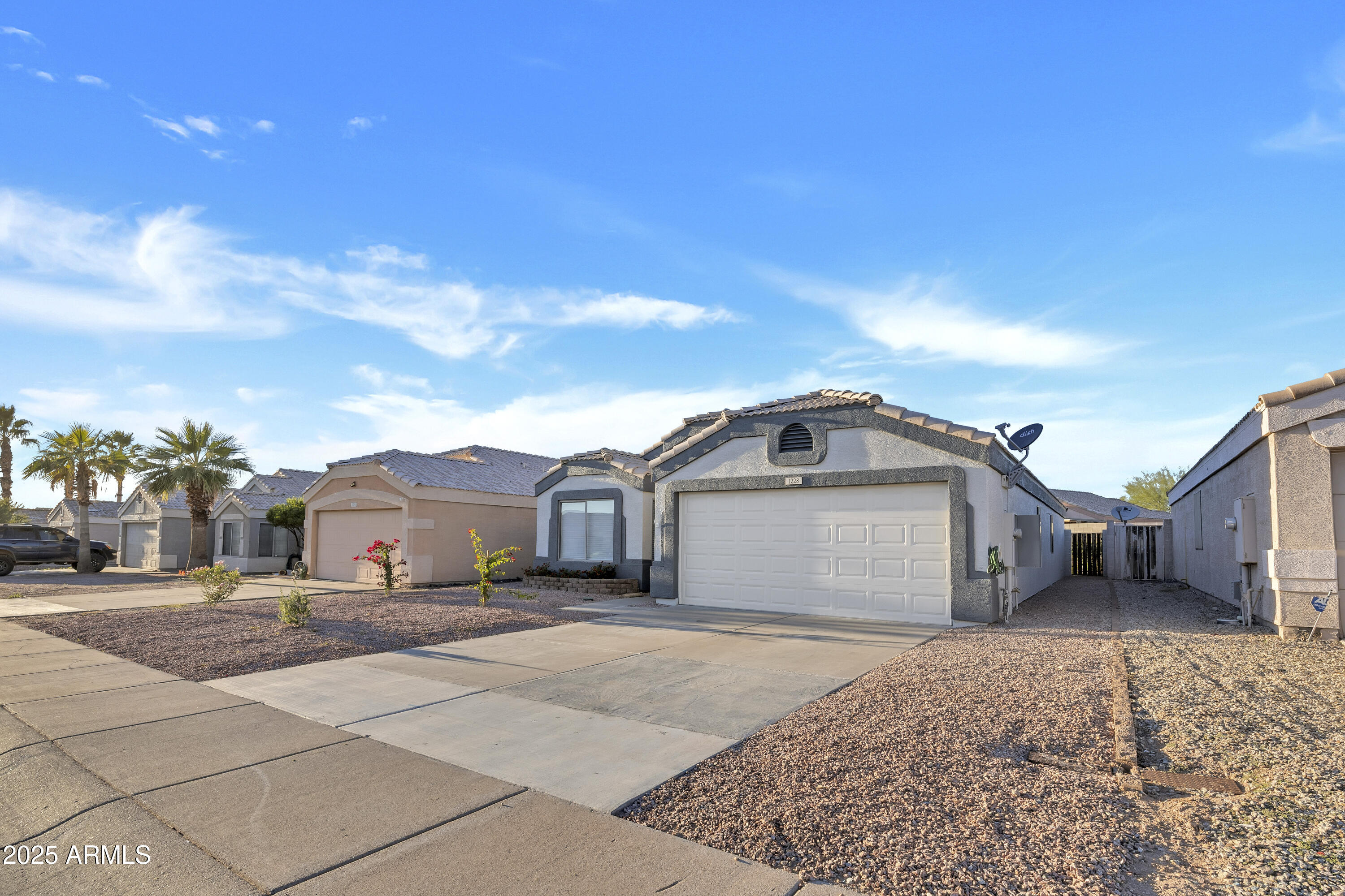 1228 West Diamond Avenue Apache Junction, AZ 85120 - Photo 3 of 25 a view of a car in front of a house