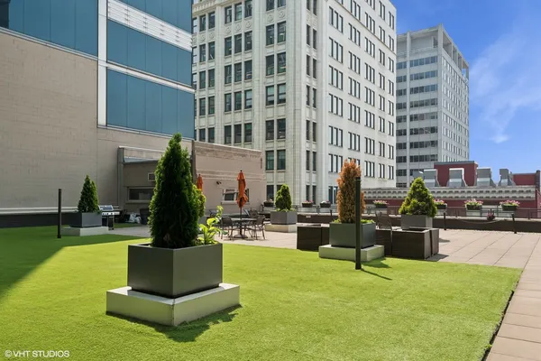 a front view of a building with outdoor seating