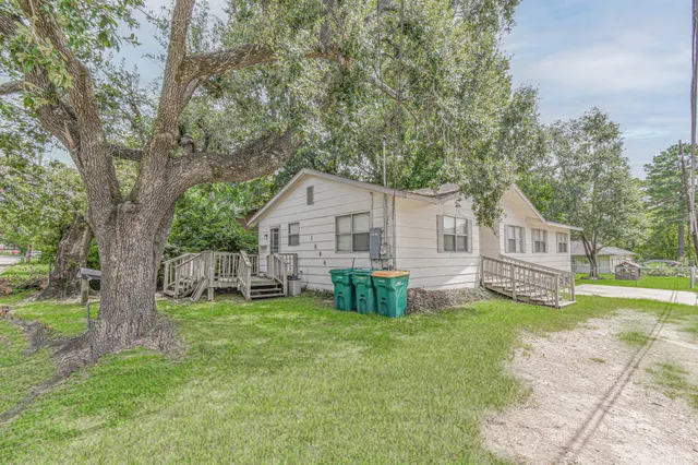 a house view with a sitting space and garden