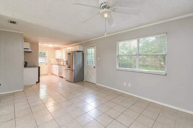 a view of a kitchen with furniture and a window