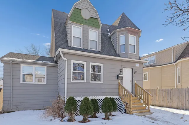a view of a brick house with a large windows