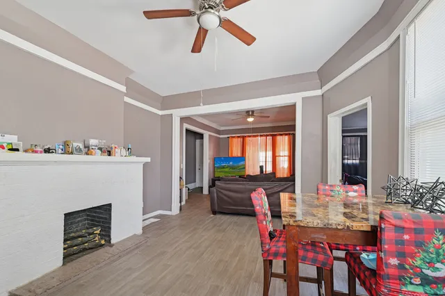 a view of a livingroom with furniture window and wooden floor
