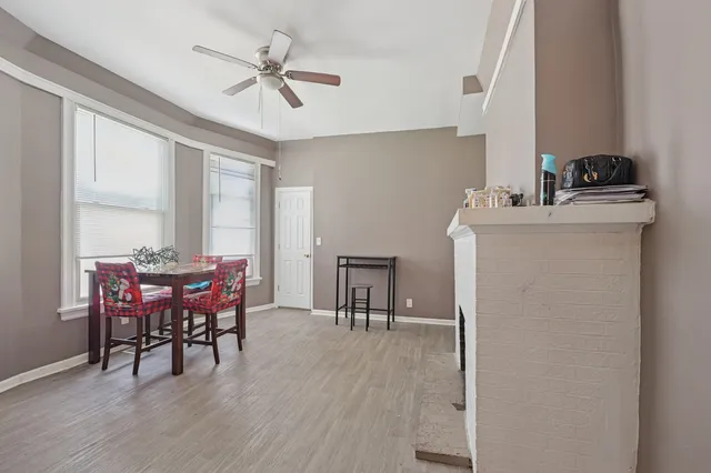 a dining room with furniture and window