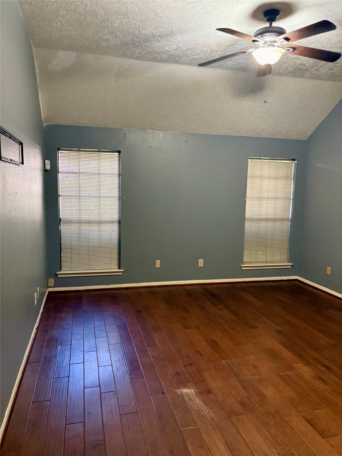 6510 Summit Ridge Court Houston, TX 77085 - Photo 9 of 10 an empty room with wooden floor and windows