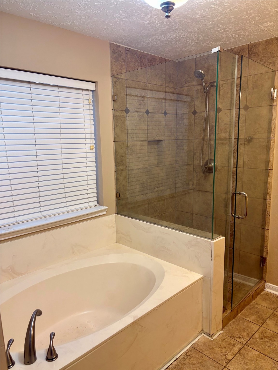 6510 Summit Ridge Court Houston, TX 77085 - Photo 10 of 10 a bathroom with a bathtub and a shower
