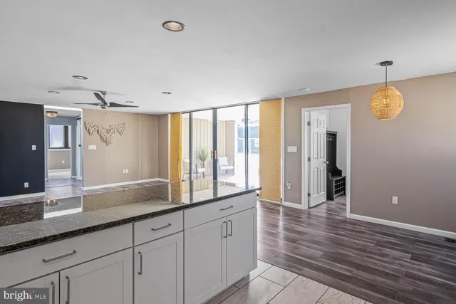 a bedroom with a large bed and a flat screen tv