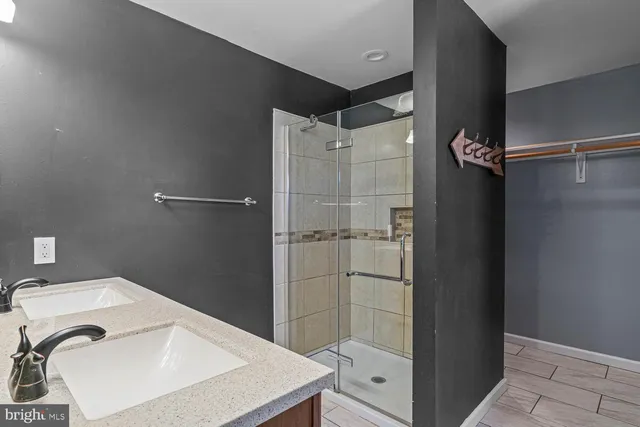 a view of a bathroom with a glass door shower