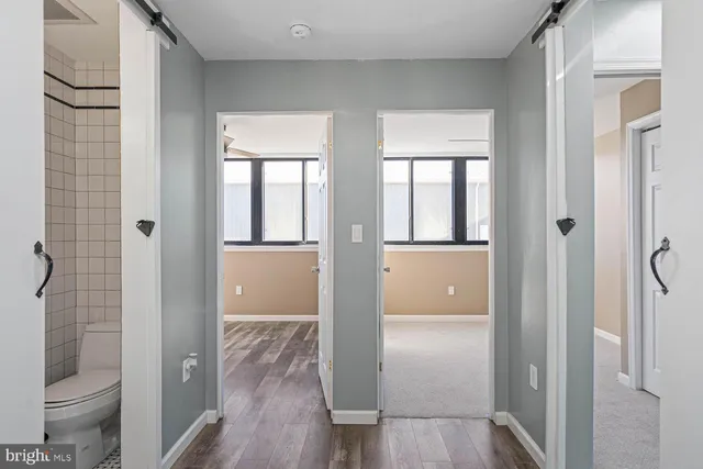 a view of room with window and a flat screen tv