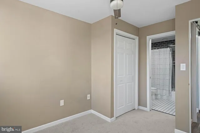 a bathroom with a shower and a sink