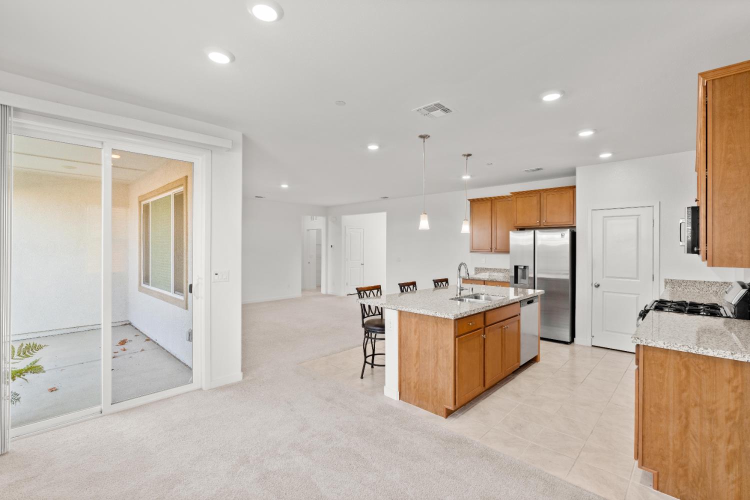 620 River Street Lincoln, CA 95648 - Photo 24 of 60 a kitchen with stainless steel appliances granite countertop a stove and a refrigerator