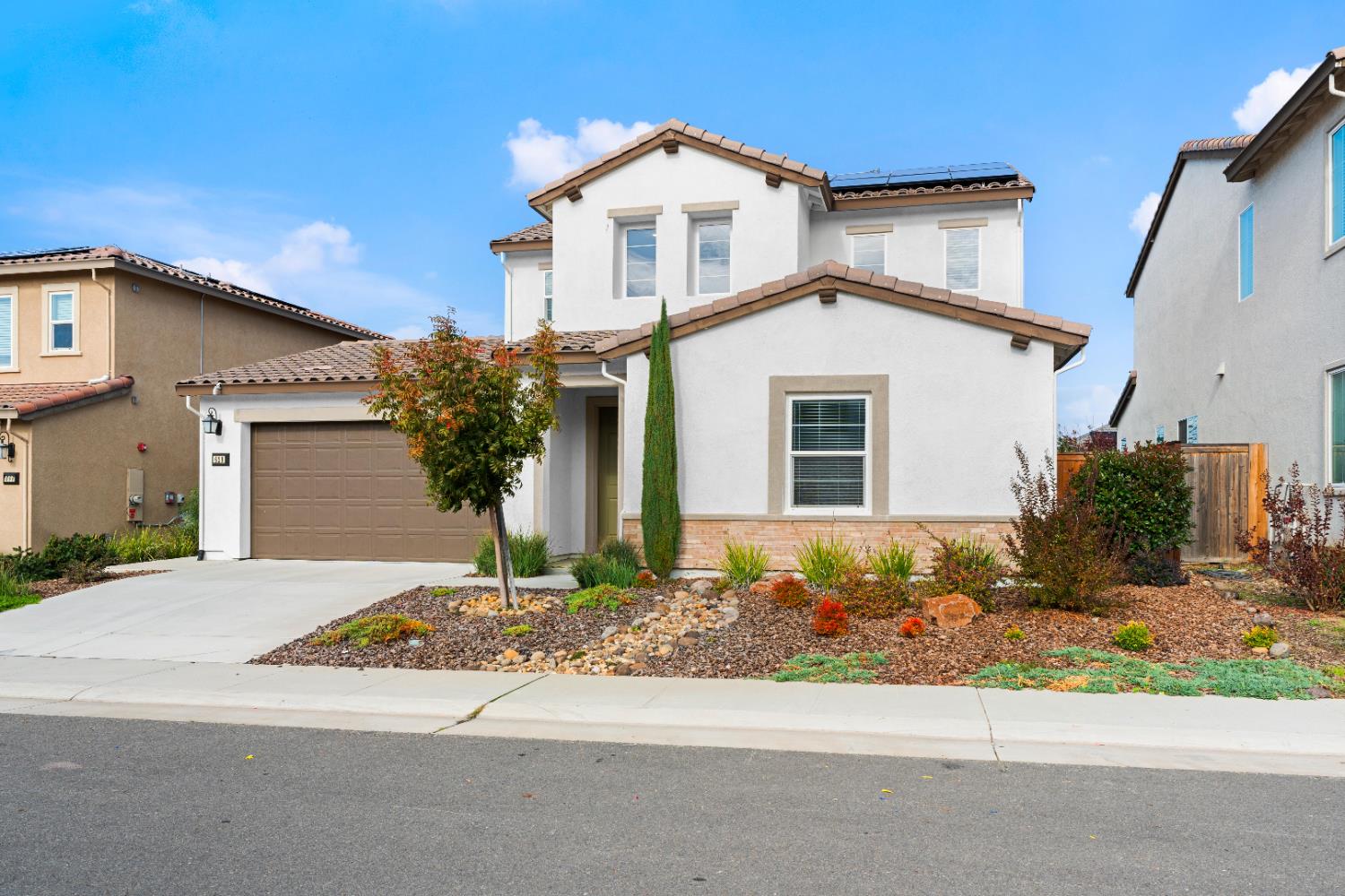 620 River Street Lincoln, CA 95648 - Photo 3 of 60 a front view of a house with a yard and garage