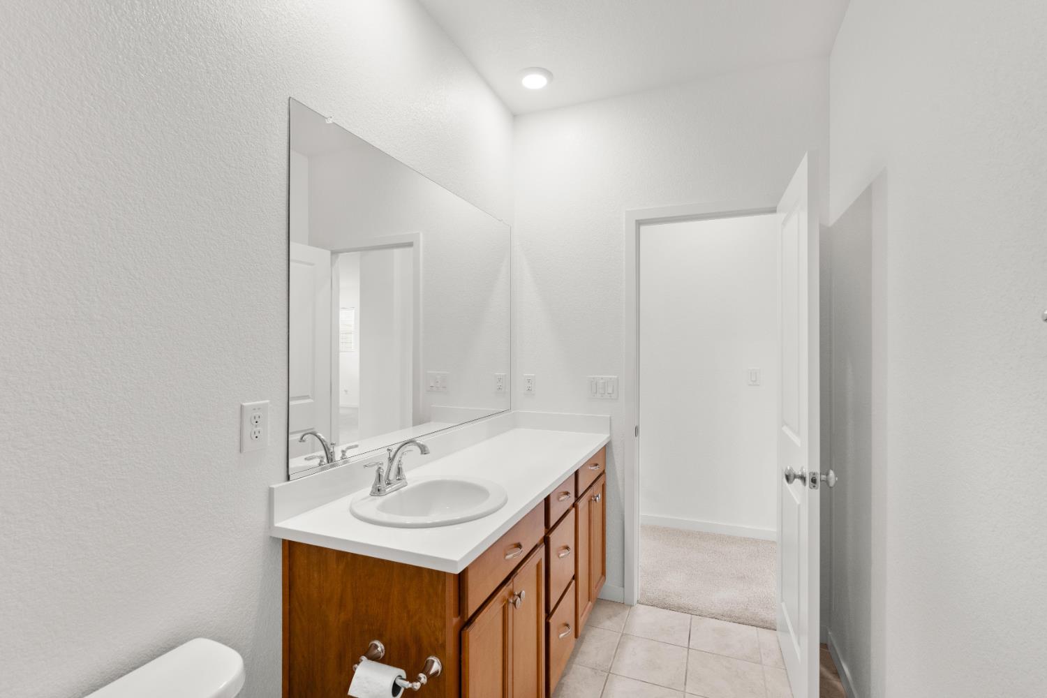 620 River Street Lincoln, CA 95648 - Photo 44 of 60 a bathroom with a sink a toilet and a mirror