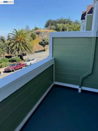 a view of a balcony with an outdoor space