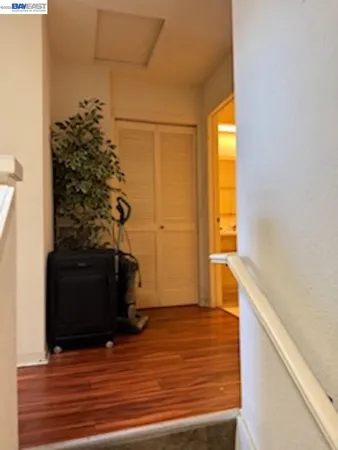a view of a entryway door with wooden floor