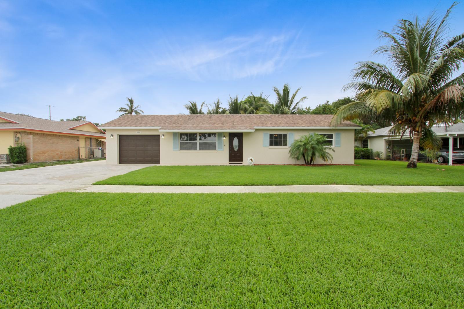 444 Davis Road Palm Springs, FL 33461 - Photo 1 of 14 2_facade