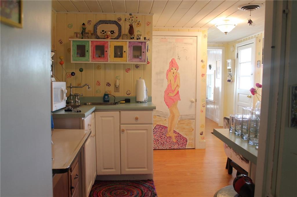 49 Garland Swamp Road Poland, ME 04274 - Photo 8 of 17 This fun mural graces the bathroom door.