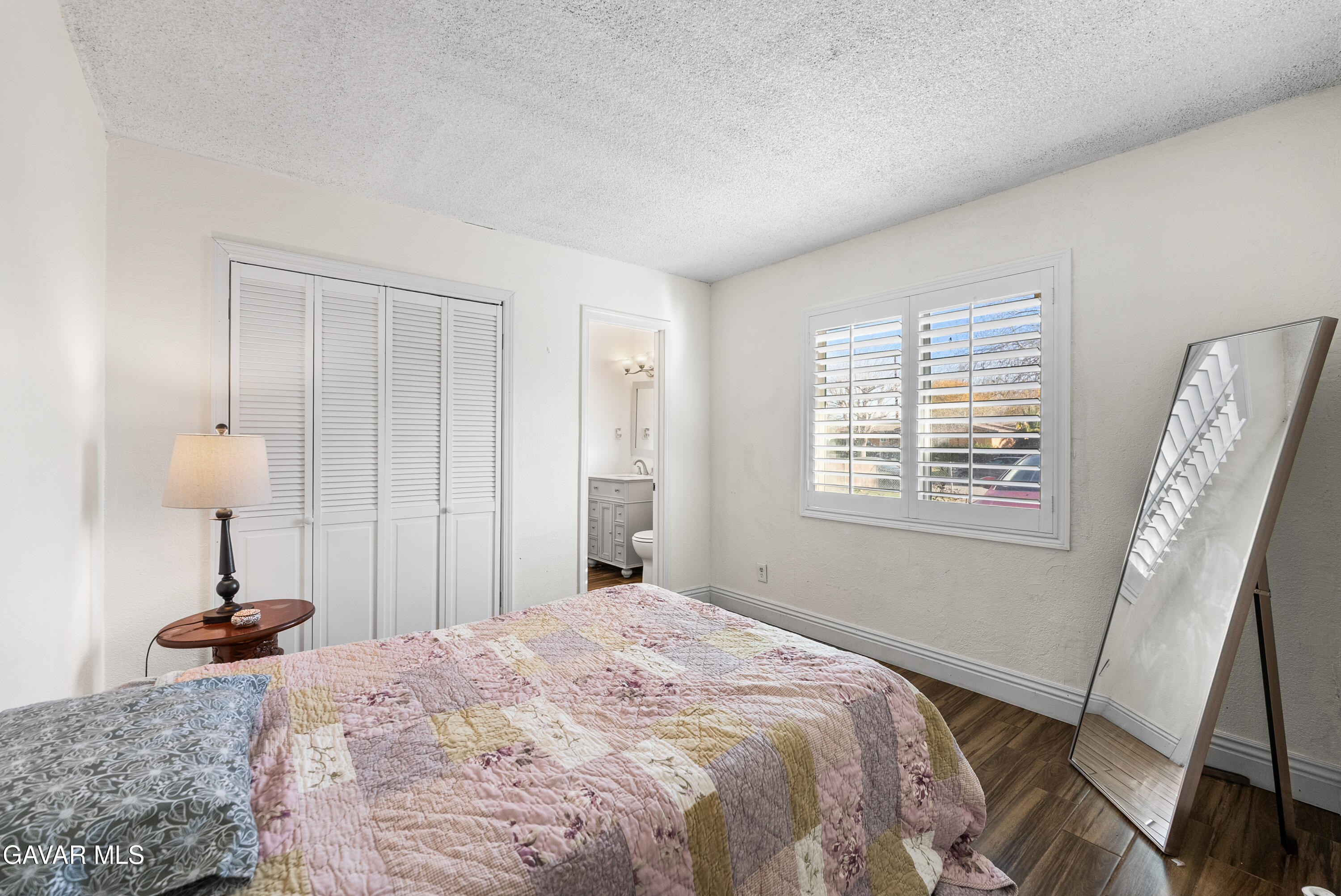 45323 Andale Avenue Lancaster, CA 93535 - Photo 16 of 28 a bedroom with a bed and a window