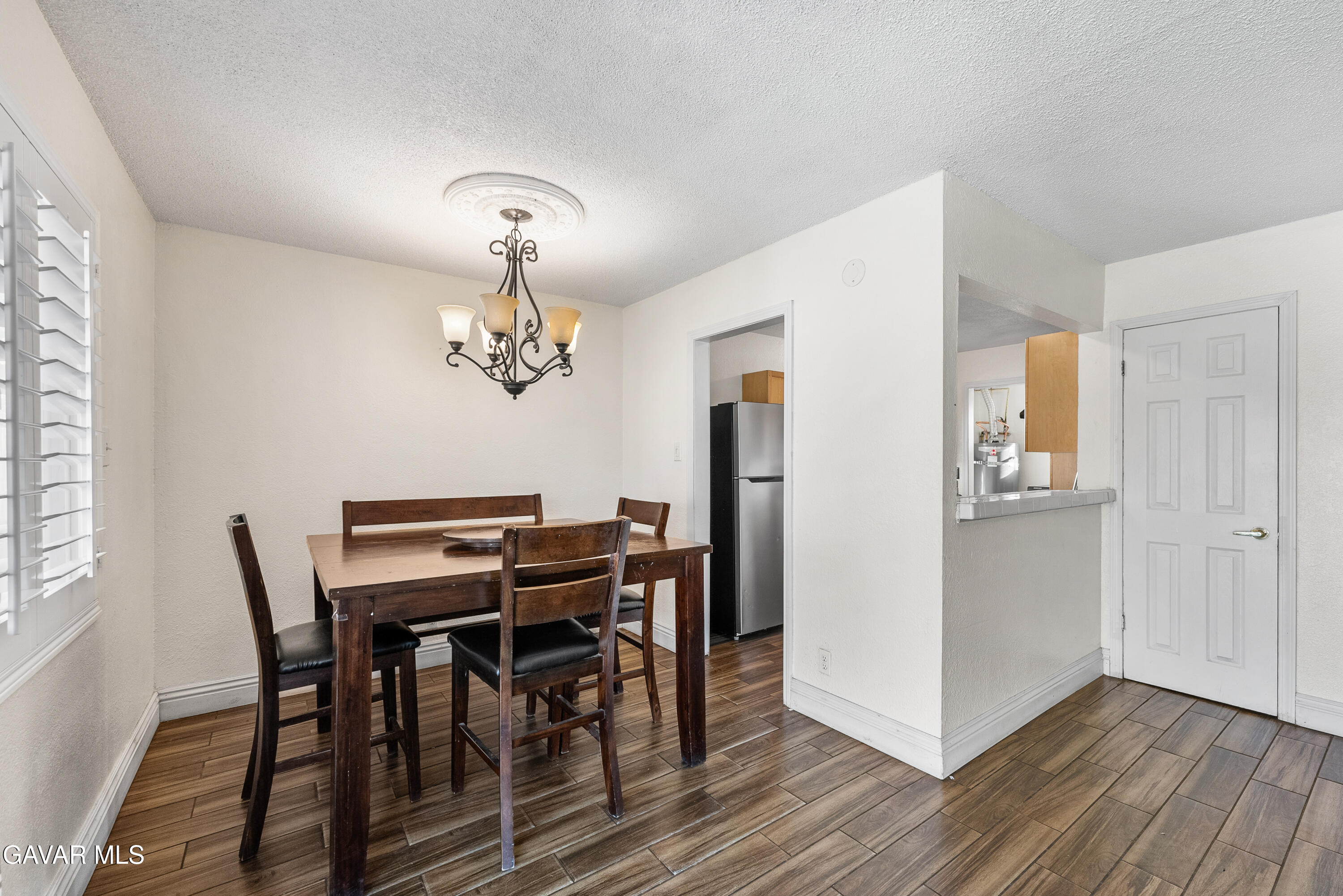 45323 Andale Avenue Lancaster, CA 93535 - Photo 8 of 28 a view of a dining room with furniture window and wooden floor