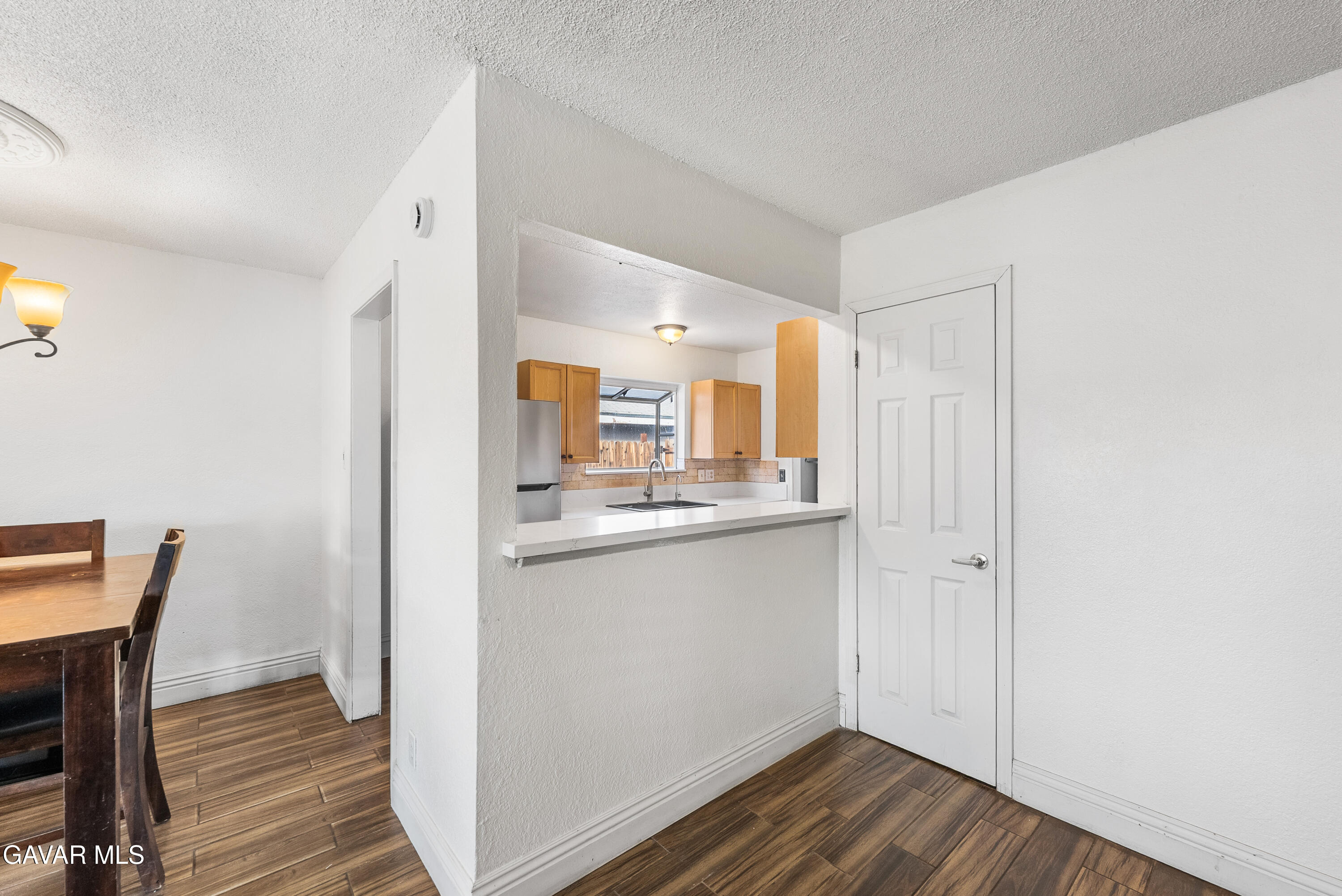 45323 Andale Avenue Lancaster, CA 93535 - Photo 10 of 28 a view of a kitchen from the hallway