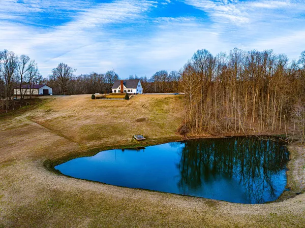 a view of swimming pool with a yard