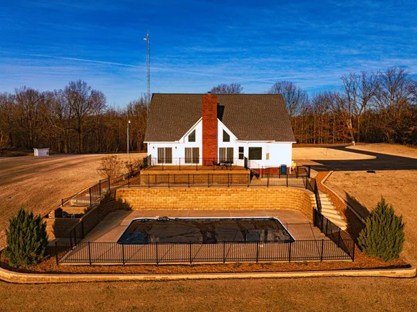 a view of a house with swimming pool