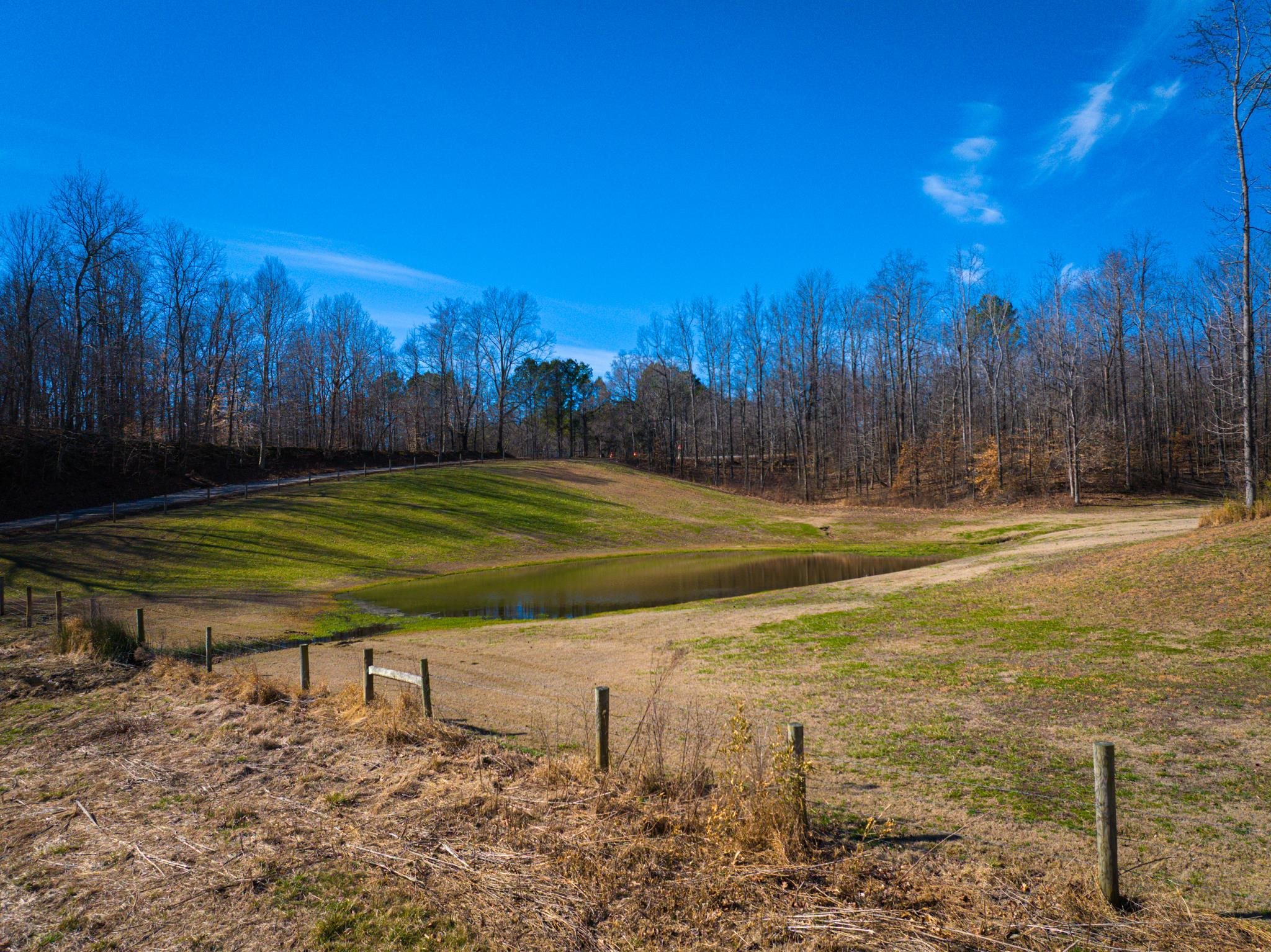 5030 Rogers Marshall Road Union City, TN 38261 - Photo 22 of 40 a view of a tennis court with a house in the background