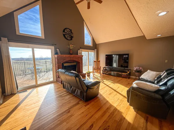 a living room with furniture fireplace and a flat screen tv