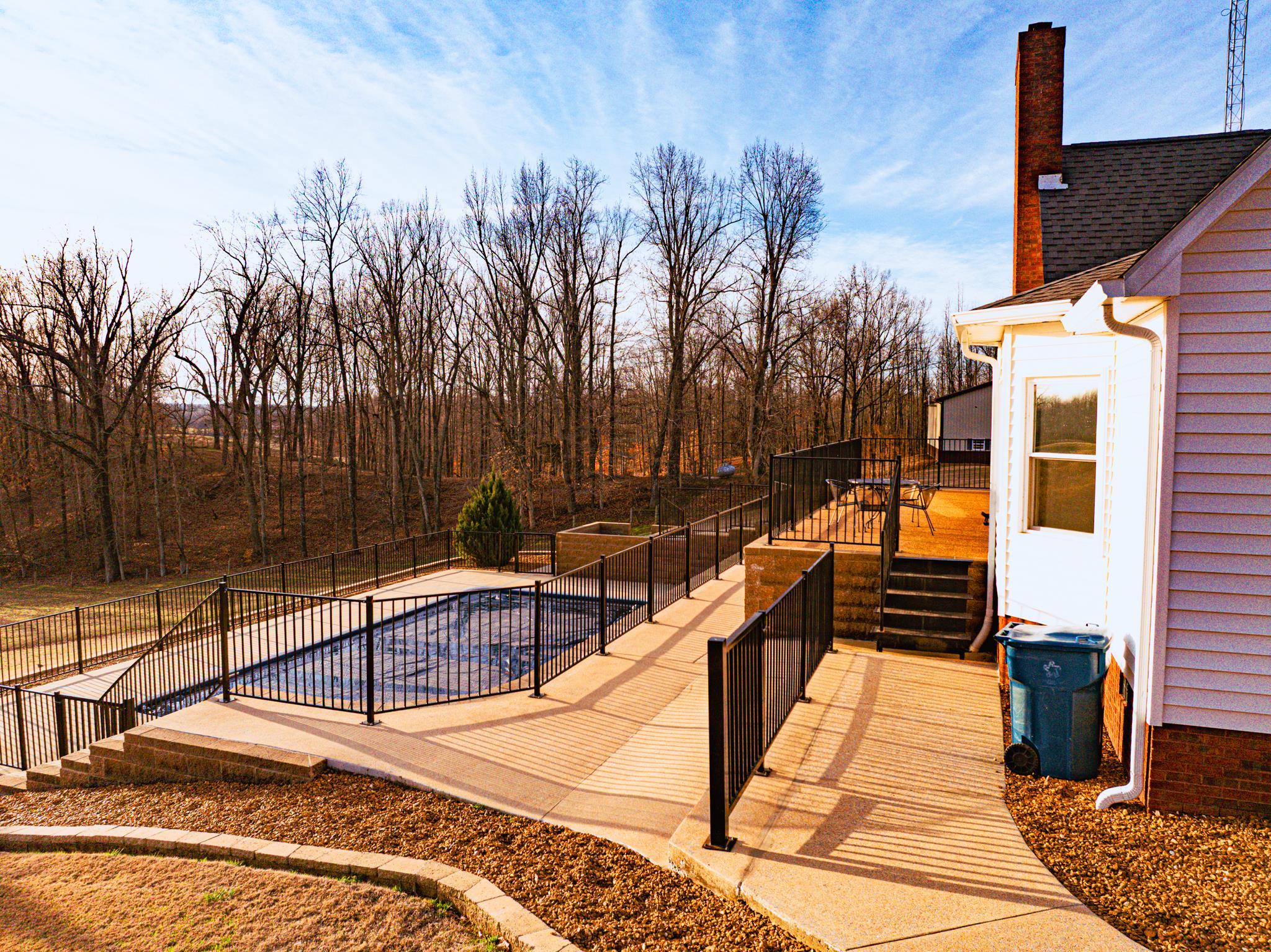 5030 Rogers Marshall Road Union City, TN 38261 - Photo 29 of 40 a view of a balcony with chairs and wooden fence