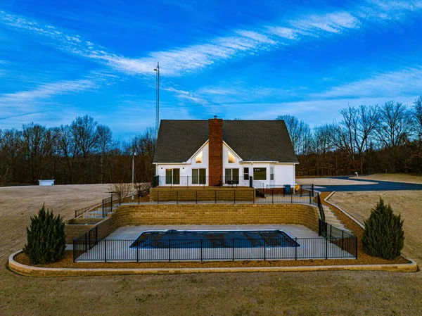 a view of a house with swimming pool