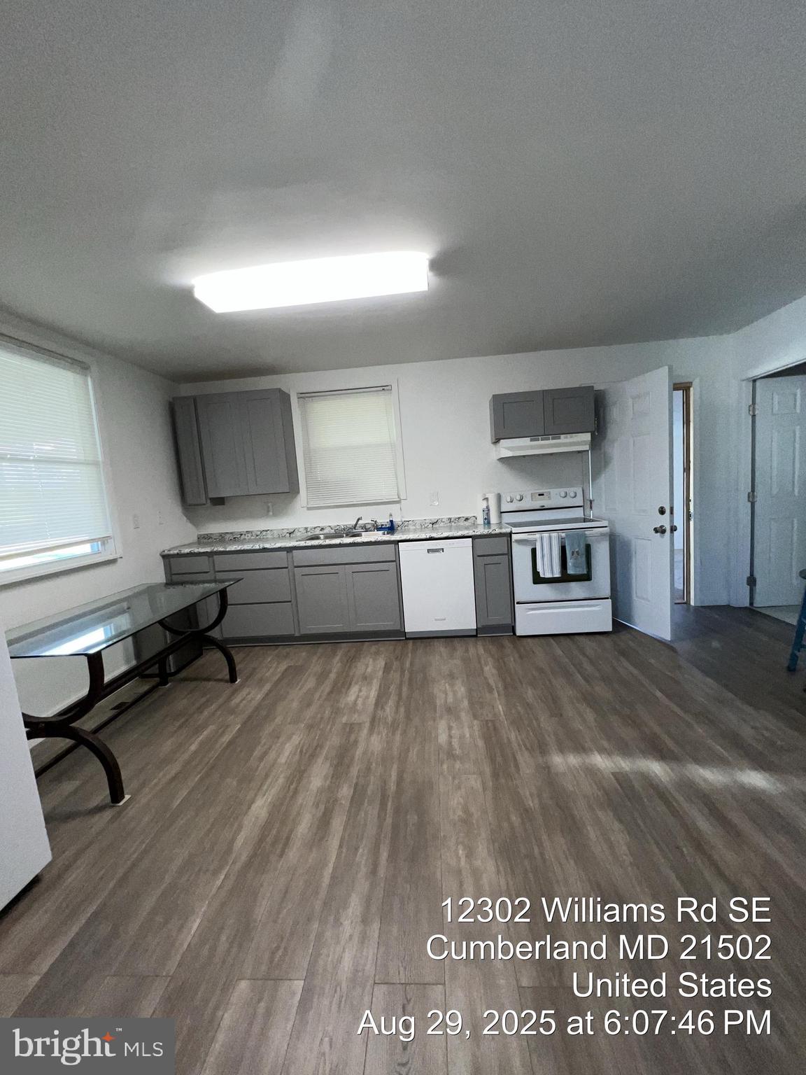 12302 Williams Road Southeast Cumberland, MD 21502 - Photo 18 of 35 a room with a couch and a stove top oven