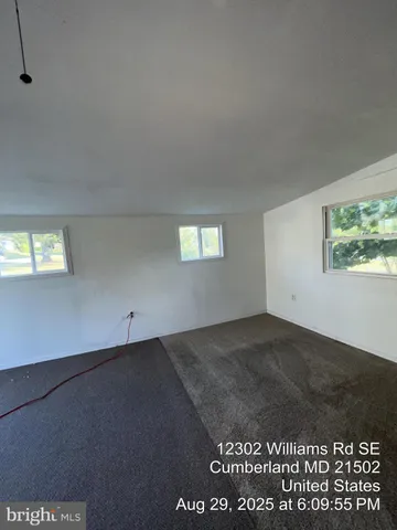 a view of an empty room and window