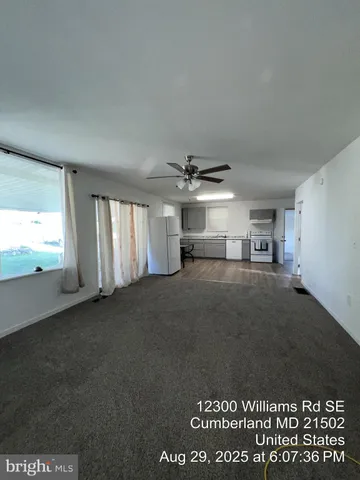 a view of empty room with windows