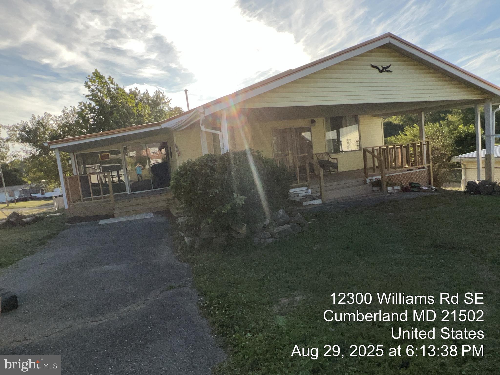 12302 Williams Road Southeast Cumberland, MD 21502 - Photo 3 of 35 a front view of a house with garden
