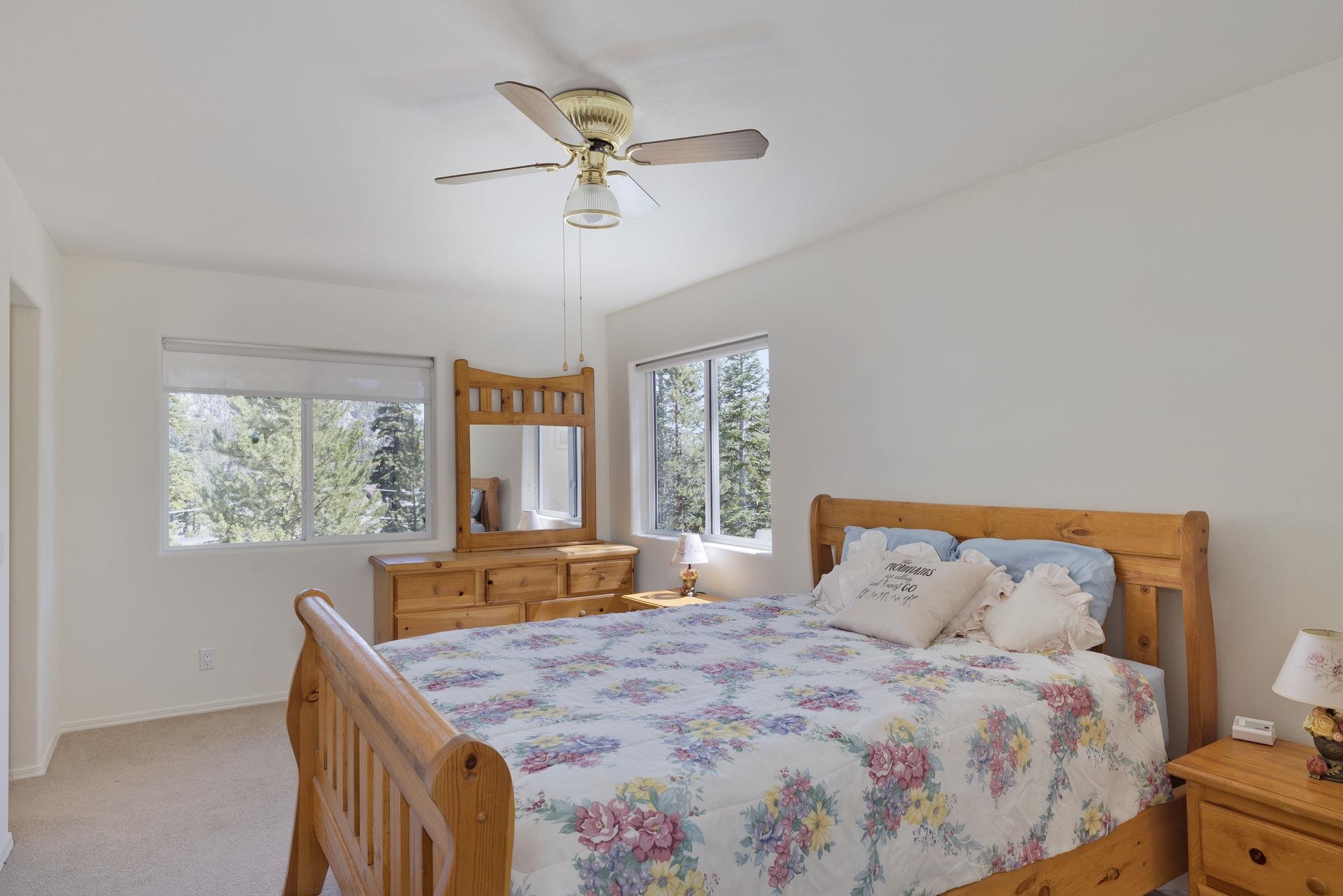 492 John Muir Road Mammoth Lakes, CA 93546 - Photo 22 of 33 White walls with two windows and a ceiling fan