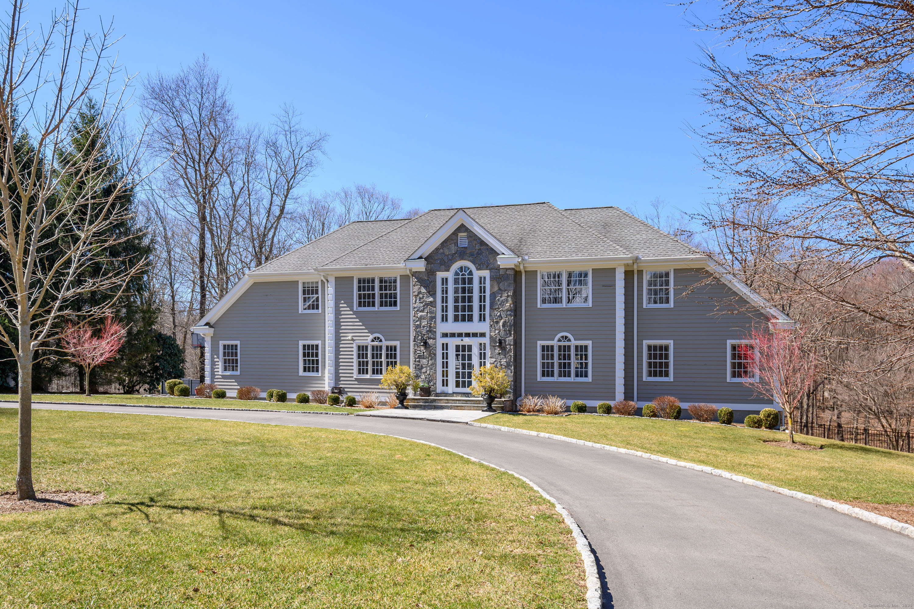 4 Dover Circle Newtown, CT 06470 - Photo 1 of 1 a view of a white house with a large pool and a yard