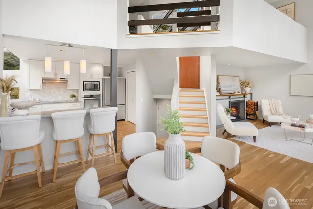a dining room with furniture and wooden floor