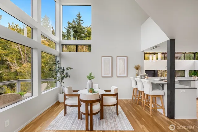 a view of a dining room with furniture and a window