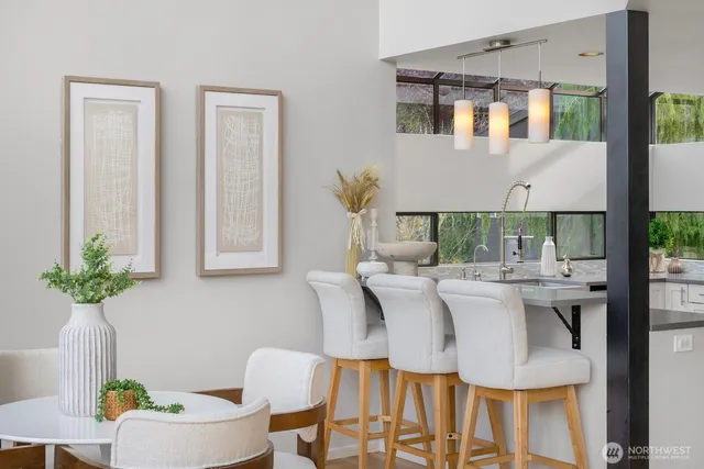 a view of kitchen with furniture and wooden floor