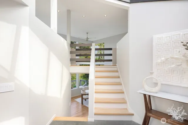 a view of entryway with furniture and wooden floor
