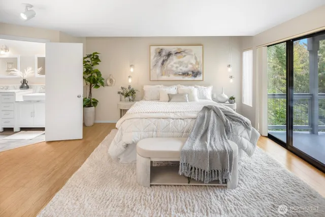 a bedroom with a bed and a painting on the wall