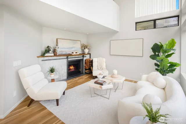 a living room with furniture and a potted plant