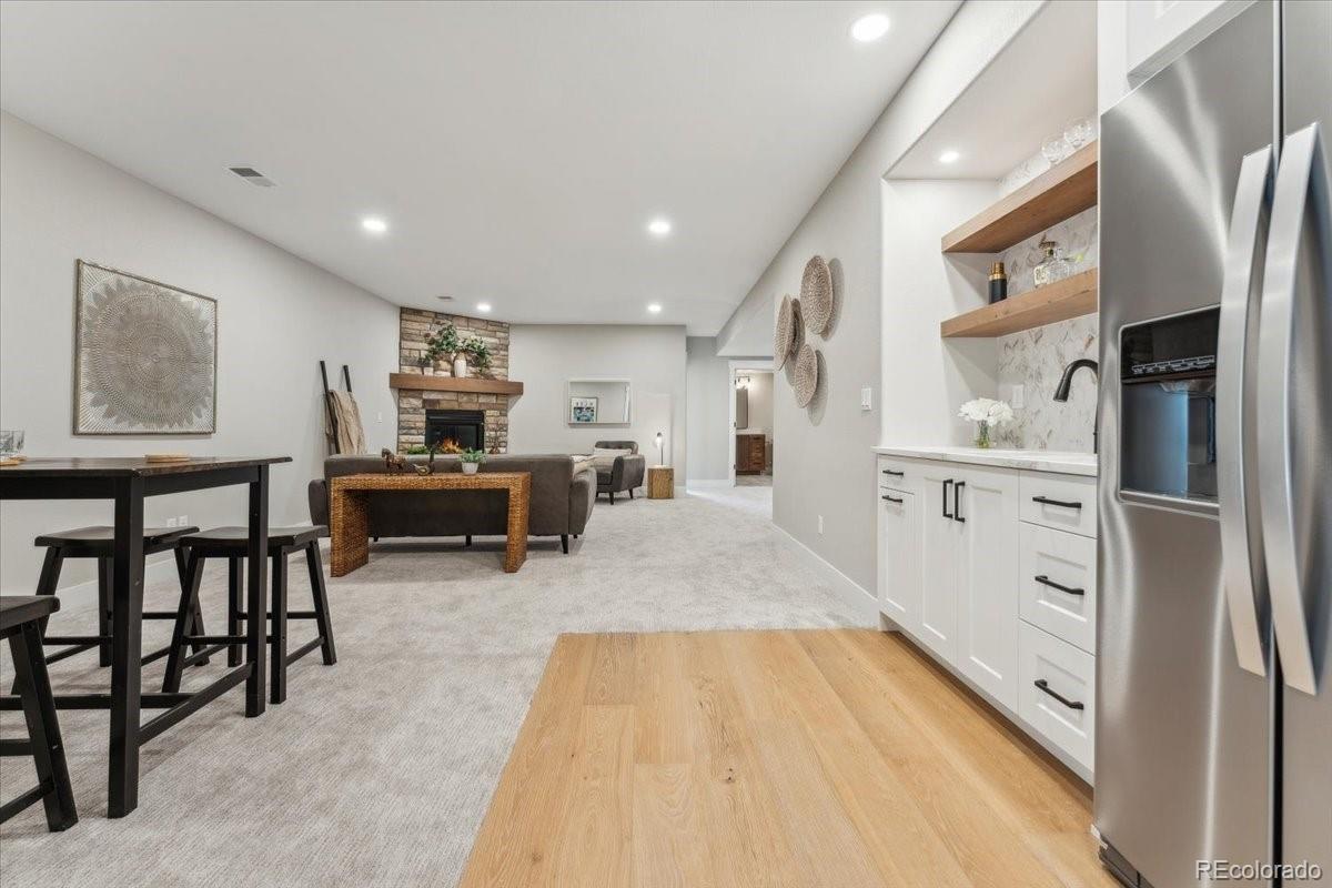 1361 Art Drive Berthoud, CO 80513 - Photo 30 of 40 a large white kitchen with cabinets